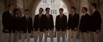 Movie still from “Admission” (2013), directed by Paul Weitz – A group of young men standing next to each other; Wide shot, Over the shoulder angle