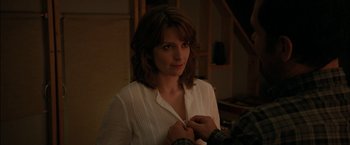 Movie still from “Admission” (2013), directed by Paul Weitz – A woman in a white shirt fixing a man's tie; Close Up shot, Over the shoulder angle