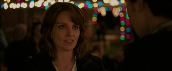 Movie still from “Admission” (2013), directed by Paul Weitz – A person wearing a jacket; Close Up shot, Over the shoulder angle