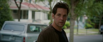 Movie still from “Admission” (2013), directed by Paul Weitz – A man standing in front of a tree; Close Up shot, Over the shoulder angle