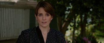 Movie still from “Admission” (2013), directed by Paul Weitz – A person with short brown hair; Close Up shot, Over the shoulder angle
