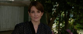 Movie still from “Admission” (2013), directed by Paul Weitz – A person wearing a black shirt; Close Up shot, Over the shoulder angle