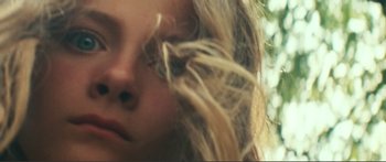 Movie still from “Adoration” (2019), directed by Fabrice du Welz – A woman's face with long blonde hair; Extreme Close Up shot, Low angle