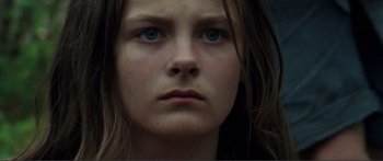 Movie still from “Adoration” (2019), directed by Fabrice du Welz – A person with blue eyes; Close Up shot, Low angle