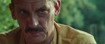 Movie still from “Adoration” (2019), directed by Fabrice du Welz – A man with a mustache; Close Up shot, Low angle