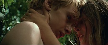 Movie still from “Adoration” (2019), directed by Fabrice du Welz – A person with their head on their shoulder; Close Up shot, Low angle