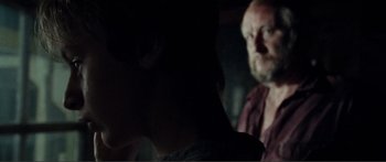 Movie still from “Adoration” (2019), directed by Fabrice du Welz – A man and a woman are looking at each other; Close Up shot, Over the shoulder angle