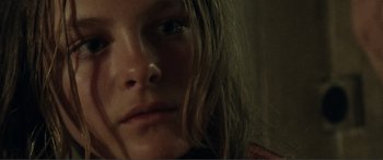 Movie still from “Adoration” (2019), directed by Fabrice du Welz – A young girl's face; Extreme Close Up shot, High angle
