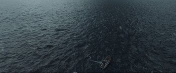 Movie still from “Adrift” (2018), directed by Baltasar Kormákur – An aerial view of a boat in the middle of the ocean; Extreme Wide shot, Overhead angle
