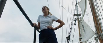 Movie still from “Adrift” (2018), directed by Baltasar Kormákur – A woman standing on top of a metal pole; Medium shot, Low angle