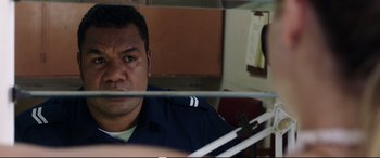 Movie still from “Adrift” (2018), directed by Baltasar Kormákur – A person in a uniform looking at a mirror; Close Up shot, Over the shoulder angle