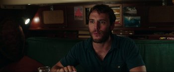 Movie still from “Adrift” (2018), directed by Baltasar Kormákur – A person sitting in a room; Close Up shot, Over the shoulder angle