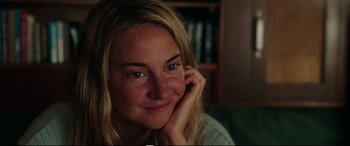 Movie still from “Adrift” (2018), directed by Baltasar Kormákur – A beautiful blonde woman sitting on a couch; Close Up shot, Over the shoulder angle