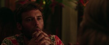 Movie still from “Adrift” (2018), directed by Baltasar Kormákur – A person sitting at a table holding his hands to his face; Close Up shot, Over the shoulder angle