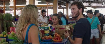 Movie still from “Adrift” (2018), directed by Baltasar Kormákur – A group of people sitting around a table with food; Medium shot, Over the shoulder angle