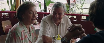 Movie still from “Adrift” (2018), directed by Baltasar Kormákur – An older man and woman sitting at a table; Close Up shot, Over the shoulder angle
