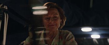 Movie still from “Adrift” (2018), directed by Baltasar Kormákur – An older woman looking at the camera; Close Up shot, Over the shoulder angle