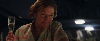 Movie still from “Adrift” (2018), directed by Baltasar Kormákur – An older woman sitting in front of a table; Close Up shot, Over the shoulder angle
