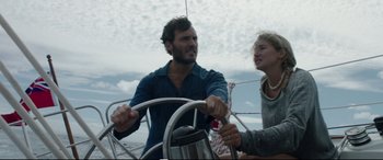 Movie still from “Adrift” (2018), directed by Baltasar Kormákur – A man and a woman on a sailboat in the ocean; Medium shot, Low angle