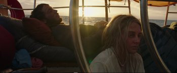 Movie still from “Adrift” (2018), directed by Baltasar Kormákur – A man and a woman on a sailboat at sunset; Medium shot, Over the shoulder angle