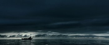 Movie still from “Adrift” (2018), directed by Baltasar Kormákur – A boat in the ocean under a cloudy sky; Extreme Wide shot, Low angle