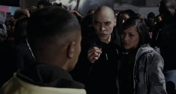 Movie still from “Adulthood” (2008), directed by Noel Clarke – A group of people on a train smoking a cigarette; Close Up shot, Over the shoulder angle