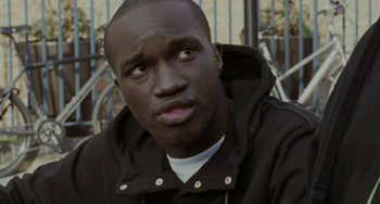 Movie still from “Adulthood” (2008), directed by Noel Clarke – A person wearing a black jacket; Close Up shot, Low angle