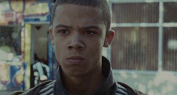 Movie still from “Adulthood” (2008), directed by Noel Clarke – A young man with a serious look on his face; Close Up shot, Low angle