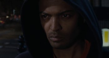 Movie still from “Adulthood” (2008), directed by Noel Clarke – A person wearing a hooded sweatshirt; Close Up shot, Low angle