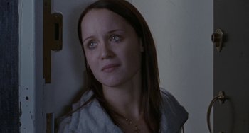 Movie still from “Adulthood” (2008), directed by Noel Clarke – A woman with blue eyes is standing against a wall; Close Up shot, High angle