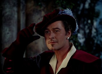 Movie still from “Adventures of Don Juan” (1948), directed by Vincent Sherman – A person wearing a hat; Close Up shot, Low angle