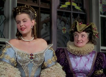 Movie still from “Adventures of Don Juan” (1948), directed by Vincent Sherman – Two women dressed up in renaissance costumes; Close Up shot, Over the shoulder angle