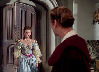 Movie still from “Adventures of Don Juan” (1948), directed by Vincent Sherman – A man and a woman dressed in medieval clothing; Medium shot, Over the shoulder angle