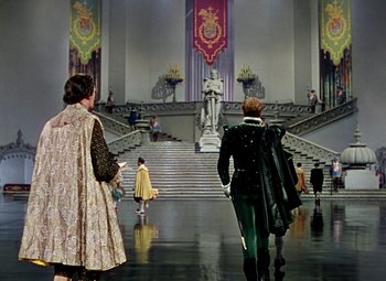 Movie still from “Adventures of Don Juan” (1948), directed by Vincent Sherman – A couple of people that are walking down the stairs; Extreme Wide shot, High angle