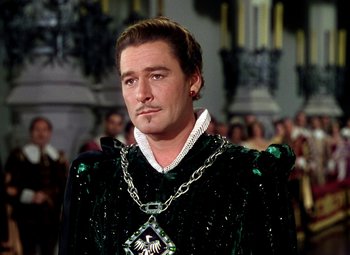 Movie still from “Adventures of Don Juan” (1948), directed by Vincent Sherman – A person wearing a suit; Close Up shot, Low angle