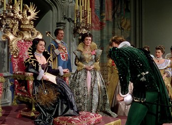 Movie still from “Adventures of Don Juan” (1948), directed by Vincent Sherman – A group of people dressed up in costumes; Wide shot, High angle