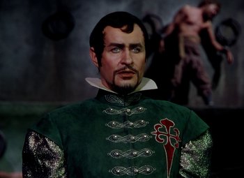 Movie still from “Adventures of Don Juan” (1948), directed by Vincent Sherman – A person wearing a costume; Medium shot, High angle