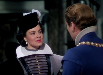 Movie still from “Adventures of Don Juan” (1948), directed by Vincent Sherman – A man and a woman dressed in medieval clothing; Medium shot, Over the shoulder angle