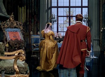 Movie still from “Adventures of Don Juan” (1948), directed by Vincent Sherman – A man and a woman dressed in medieval clothing; Wide shot, Over the shoulder angle
