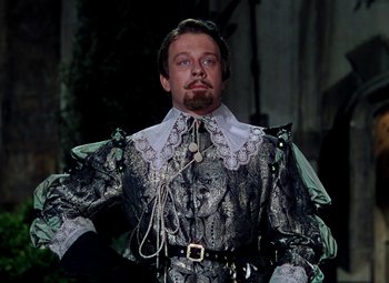 Movie still from “Adventures of Don Juan” (1948), directed by Vincent Sherman – A man dressed in renaissance garb with a beard; Medium shot, Low angle