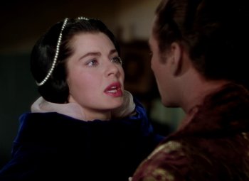 Movie still from “Adventures of Don Juan” (1948), directed by Vincent Sherman – A man and a woman are talking to each other; Close Up shot, Over the shoulder angle