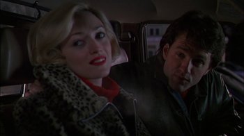 Movie still from “Affliction” (1997), directed by Paul Schrader – A man and a woman sitting in the back of a car; Close Up shot, Over the shoulder angle