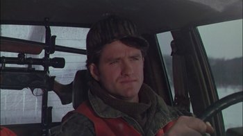 Movie still from “Affliction” (1997), directed by Paul Schrader – A man sitting in the driver's seat of a car; Close Up shot, Over the shoulder angle