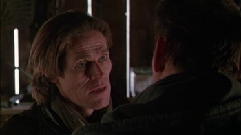 Movie still from “Affliction” (1997), directed by Paul Schrader – A person looking at a mirror; Close Up shot, Over the shoulder angle