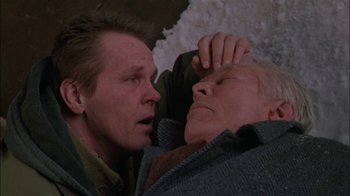 Movie still from “Affliction” (1997), directed by Paul Schrader – A man and an old man are looking into each other's eyes; Close Up shot, High angle