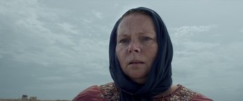 Movie still from “After Love” (2020), directed by Aleem Khan – A person wearing a headscarf; Close Up shot, Low angle