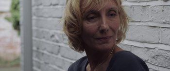 Movie still from “After Love” (2020), directed by Aleem Khan – A person with blonde hair; Close Up shot, Over the shoulder angle