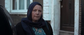 Movie still from “After Love” (2020), directed by Aleem Khan – A middle aged woman wearing a head scarf; Close Up shot, Over the shoulder angle