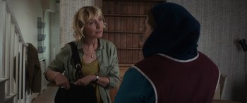 Movie still from “After Love” (2020), directed by Aleem Khan – Two women are standing in a room talking to each other; Medium shot, Over the shoulder angle