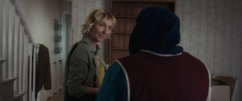 Movie still from “After Love” (2020), directed by Aleem Khan – A woman standing next to another woman in a room; Close Up shot, Over the shoulder angle